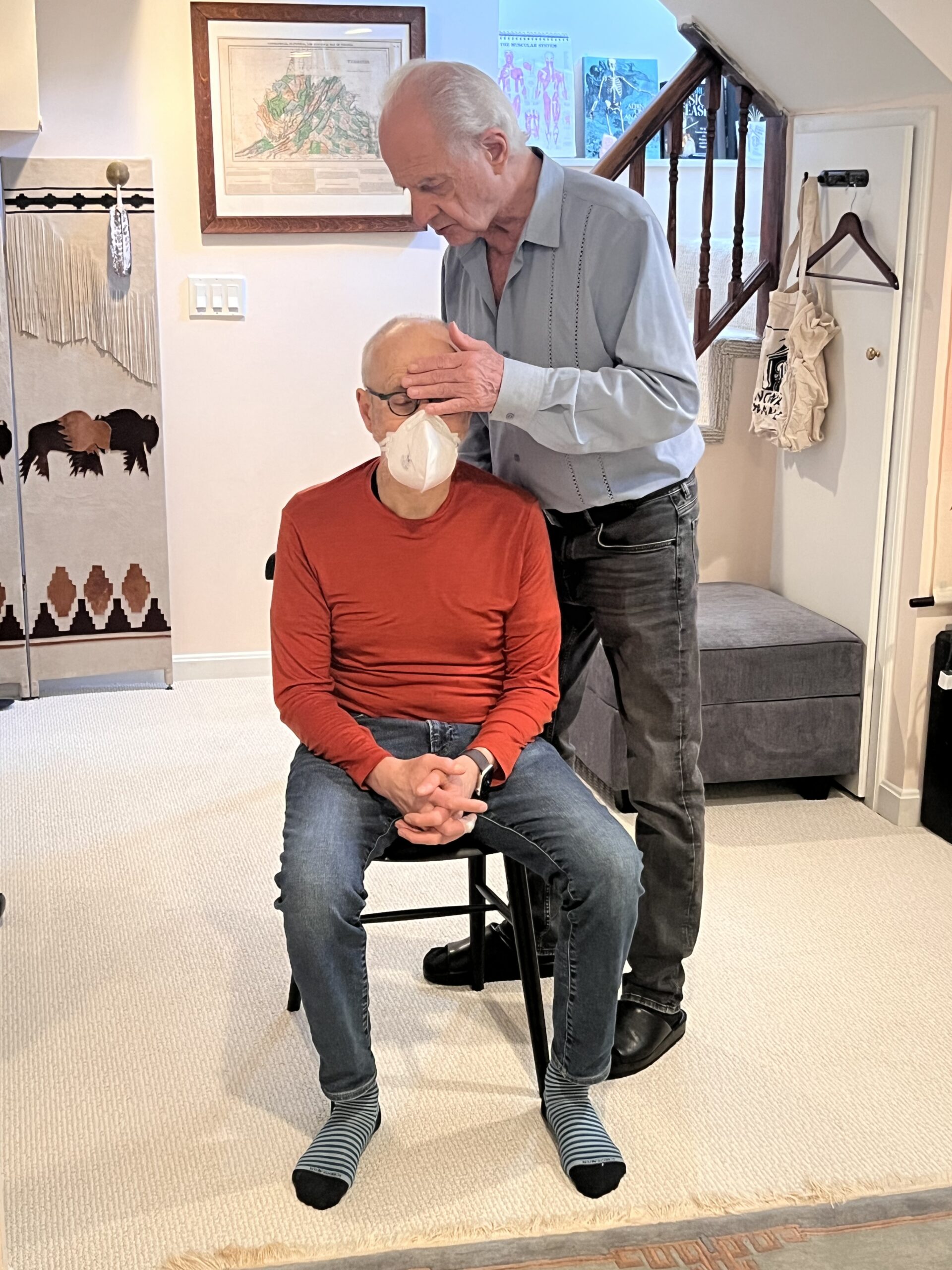 Tommy Thompson guiding a trainee in the Alexander Technique during a movement identity training class.