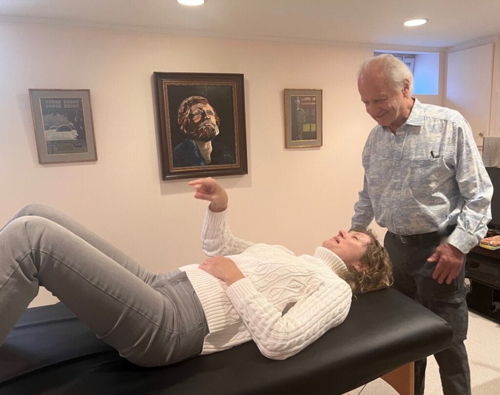 Tommy Thompson engaging with a trainee during a Gravity Flow class in Alexander Technique teacher training