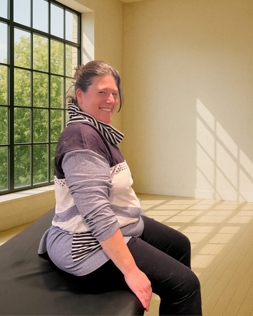 Lily sitting peacefully after an Alexander Technique class with Tommy Thompson, expressing calm and alignment through Triadic Resonance and full support.