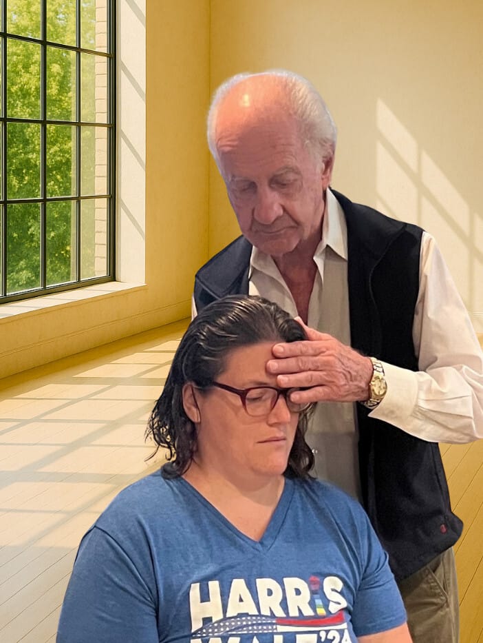 Trainee in Alexander Technique Class 22 receiving gentle, guided touch from Tommy Thompson to explore conscious use of the self