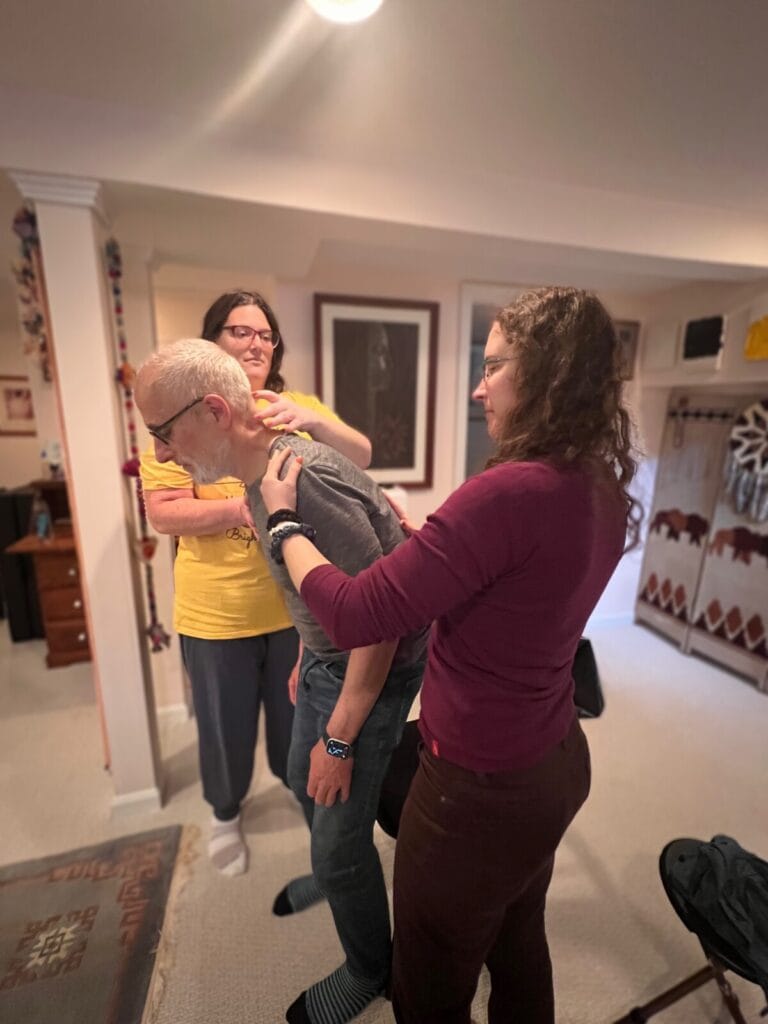 Trainees apply hands-on guidance in an Alexander Technique class, working with use and embodied direction