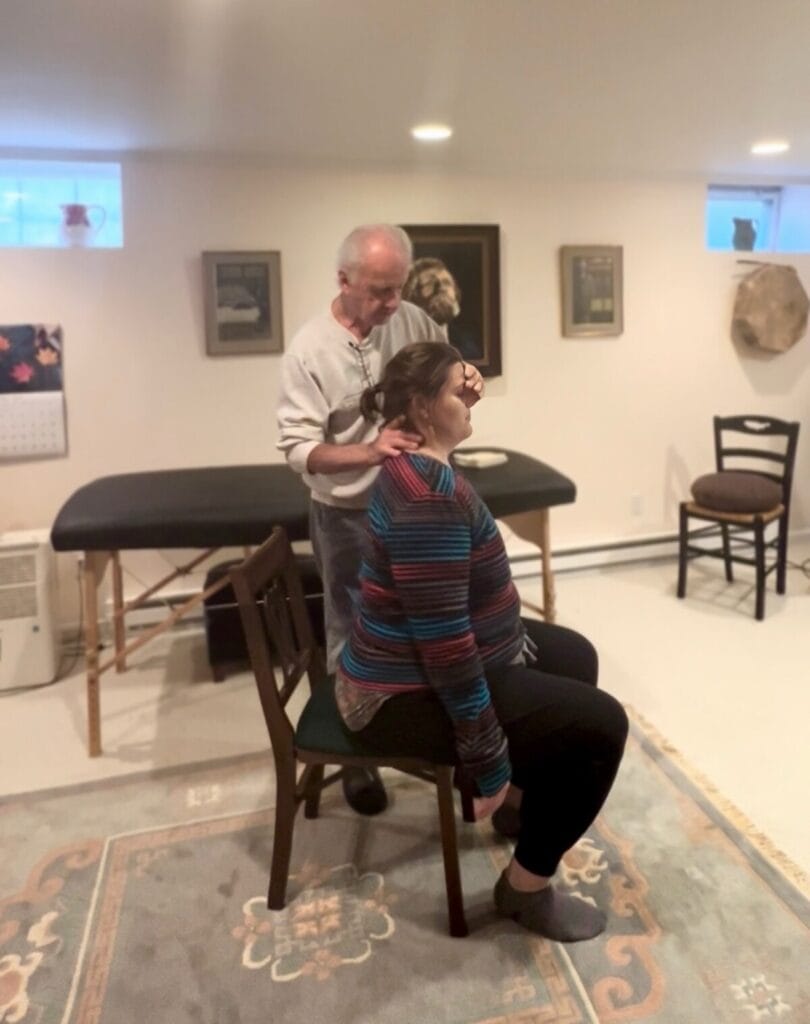 Tommy Thompson guiding a trainee during an Alexander Technique class focused on how to use yourself with awareness.