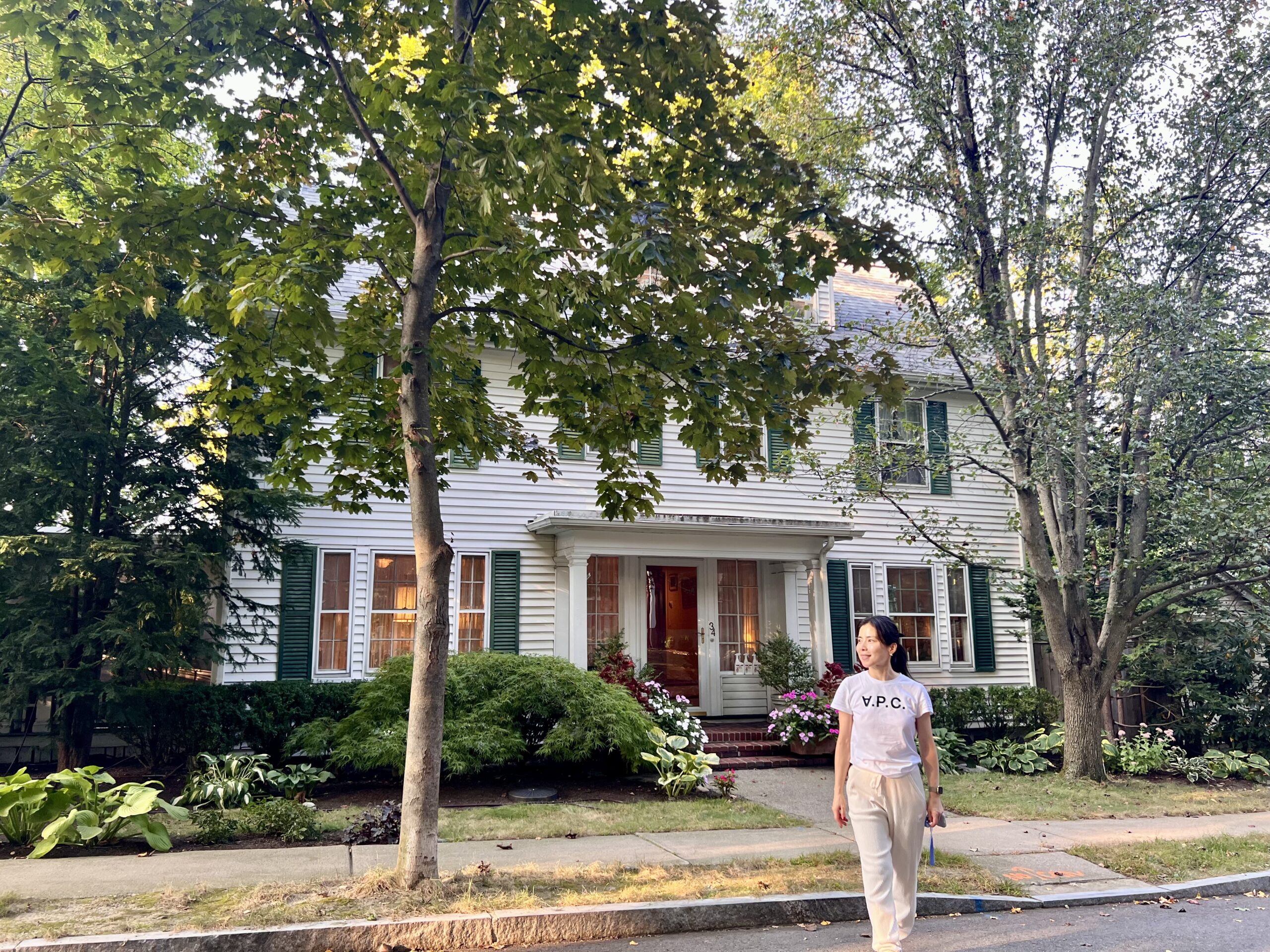 Ari Kim walking in front of Tommy Thompson’s home in Boston, marking the first day of her Alexander Technique training journey