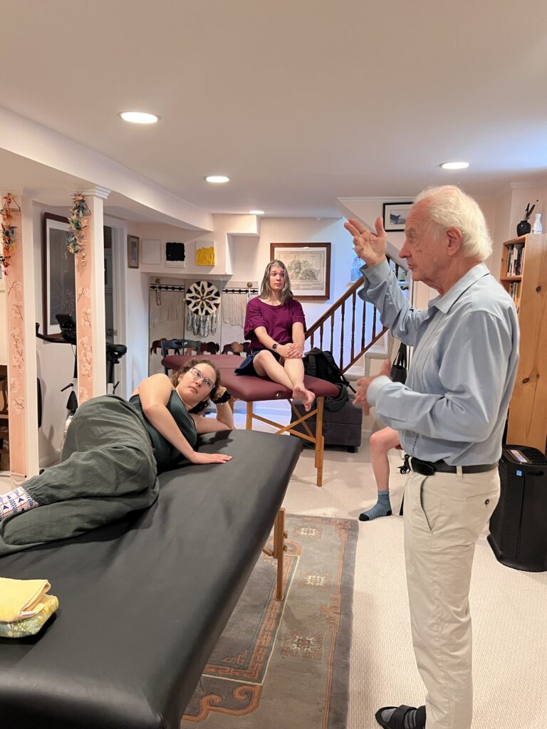 Alexander Technique trainees listening to Tommy Thompson during class 069, learning about the relational self and embodied presence.