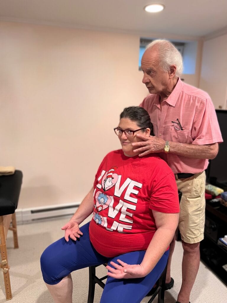 Tommy Thompson using Alexander Technique touch to guide a trainee in exploring their own use during Class 075