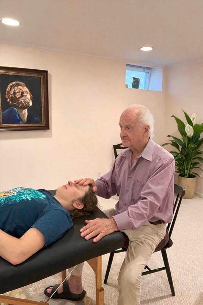 Alexander Technique support demonstrated by Tommy Thompson during class 83 with a trainee receiving hands-on guidance